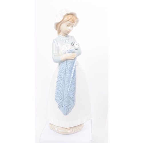 185 - Lladro - Nao - Five late 20th century porcelain figures. Comprised of a two babies no. 5772, a toddl... 