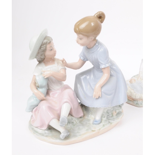 186 - Lladro - Nao - Five late 20th century porcelain figures. Comprised of a mother and a child in a crad... 