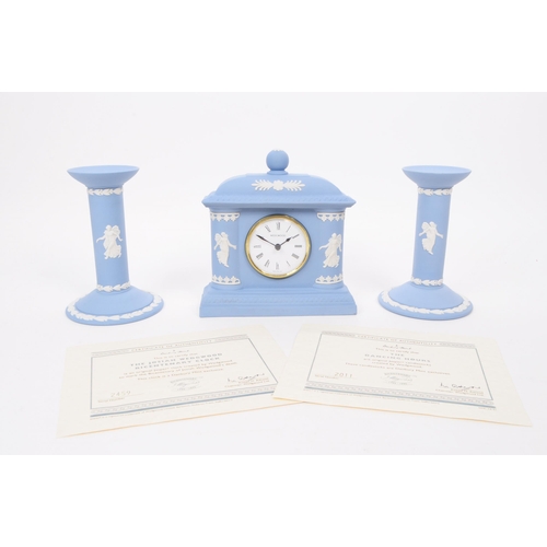 187 - Wedgwood - Vintage late 20th century porcelain mantel clock and candlesticks. Comprised of a Josiah ... 