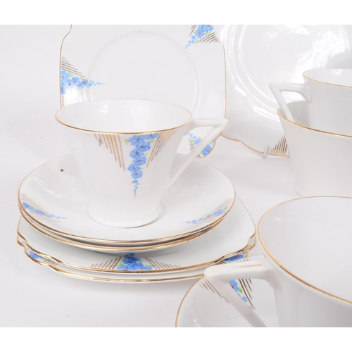 198 - Art Deco porcelain china tea service set. Two persons service with cups, saucers, side plates (trios... 