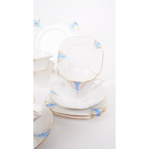 198 - Art Deco porcelain china tea service set. Two persons service with cups, saucers, side plates (trios... 