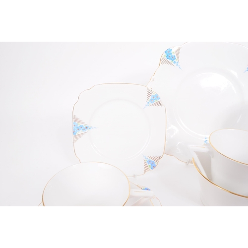 198 - Art Deco porcelain china tea service set. Two persons service with cups, saucers, side plates (trios... 