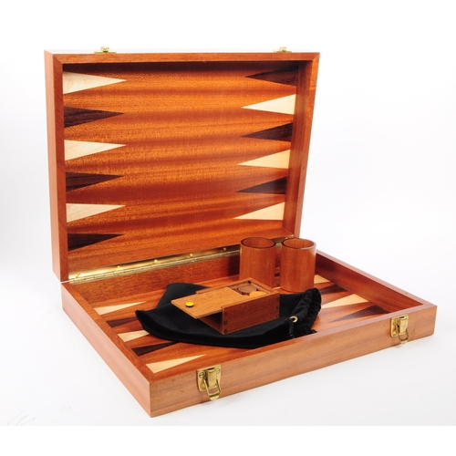 205 - Two modern backgammon board game cases. House in a hinged wooden box. With pieces, black tie sack, t... 