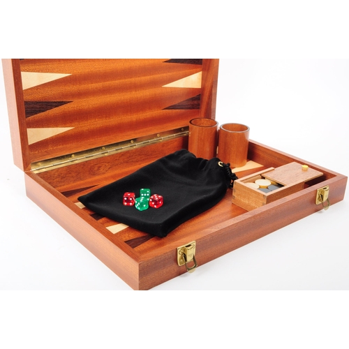 205 - Two modern backgammon board game cases. House in a hinged wooden box. With pieces, black tie sack, t... 