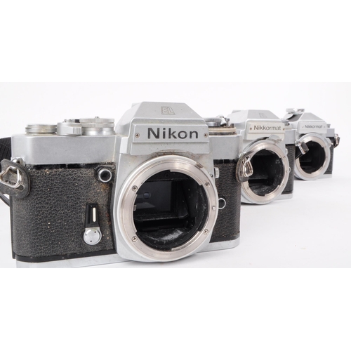 209 - Nikon - A collection of three vintage mid 20th century Nikon 35mm SLR camera bodies. The collection ... 