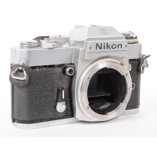 209 - Nikon - A collection of three vintage mid 20th century Nikon 35mm SLR camera bodies. The collection ... 