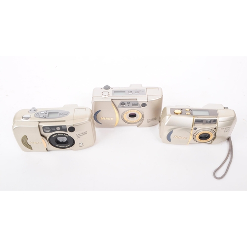 211 - Nikon - A collection of three early 2000s Nikon Lite Touch compact 35mm cmaeras. The collection to i... 