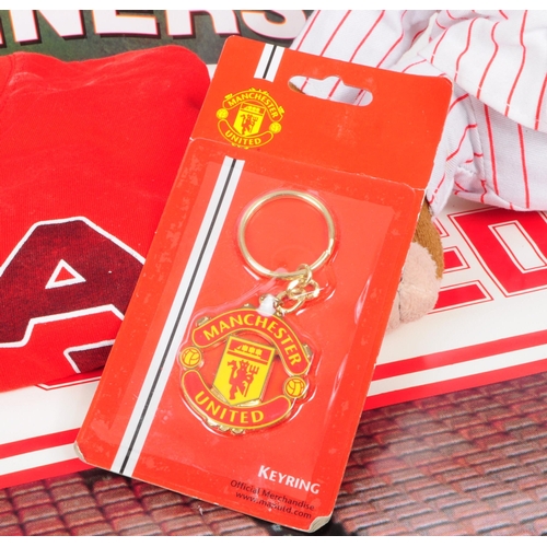 217 - Manchester United - A collection of Manchester United memorabilia to include two posters, pencil cas... 