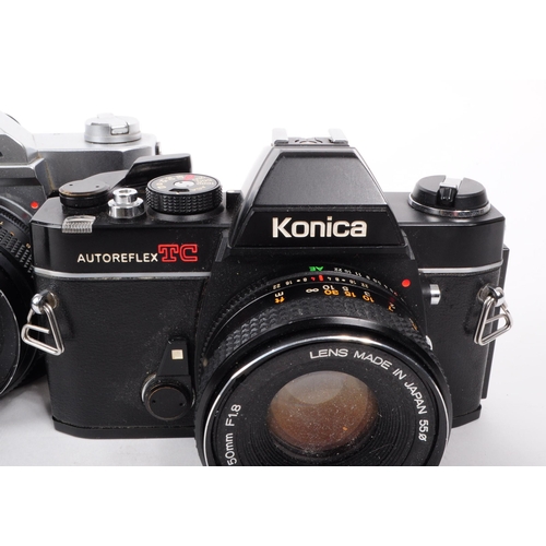 221 - Konica - Two vintage 20th century Konica AutoReflex 35mm SLR cameras with lenses. The collection to ... 