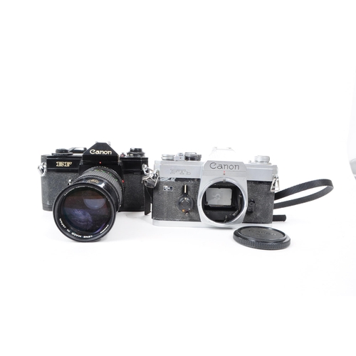 233 - Canon - Two vintage 20th century 1970s Canon 35mm SLR cameras. The collection to include a silver bo... 