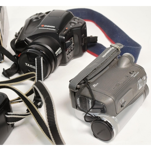 239 - A collection of vintage video and photo cameras, including both digital and film. Comprised of a Can... 