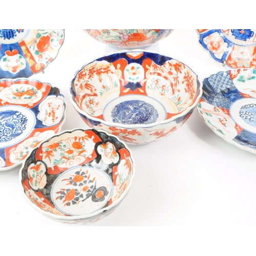 24 - A collection of vintage early 20th century Chinese imari plates and bowls, comprised of three bowls,... 