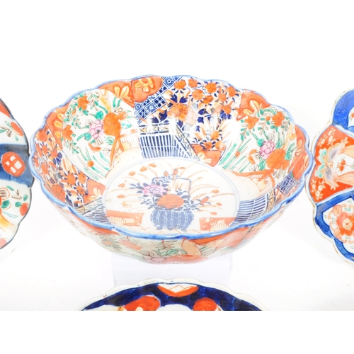 24 - A collection of vintage early 20th century Chinese imari plates and bowls, comprised of three bowls,... 