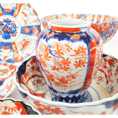 24 - A collection of vintage early 20th century Chinese imari plates and bowls, comprised of three bowls,... 