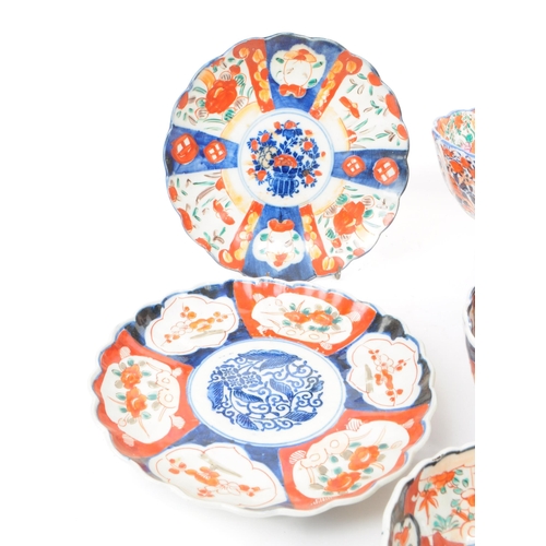 24 - A collection of vintage early 20th century Chinese imari plates and bowls, comprised of three bowls,... 