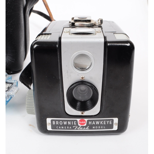 241 - A collection of four vintage Kodak cameras, comprised of a Brownie Hawkeye camera flash model, a Bro... 