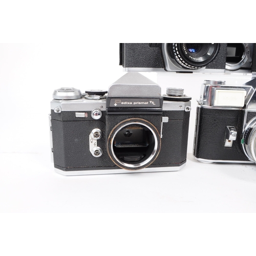 242 - A collection of vintage mid 20th century 35mm SLR cameras. The collection featuring six 35mm SLR cam... 