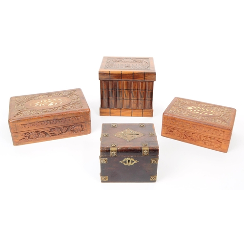 373 - A collection of four 20th century carved wooden trinket / jewllery boxes. Including a small brass ba... 