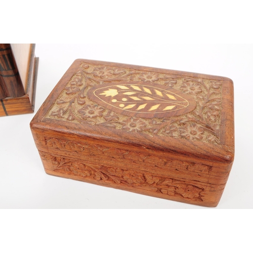 373 - A collection of four 20th century carved wooden trinket / jewllery boxes. Including a small brass ba... 