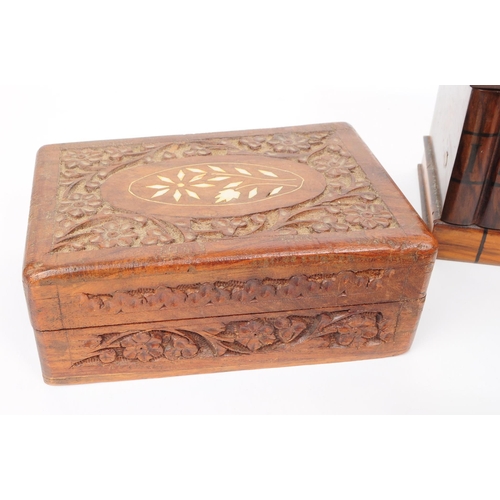 373 - A collection of four 20th century carved wooden trinket / jewllery boxes. Including a small brass ba... 