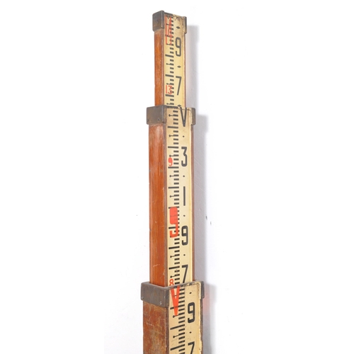 374 - An early 20th century circa 1920s oak & brass three tier surveyors extending measuring rod staff... 