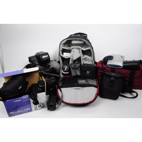 380 - Collection of late 20th / 21st century SLR cameras and accessories. Examples including a Canon EOS 4... 