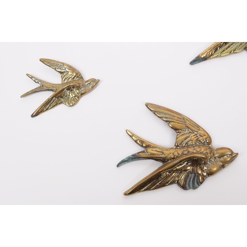 384 - A collection of vintage 20th century decorative brass swallow bird wall hangings. The collection to ... 