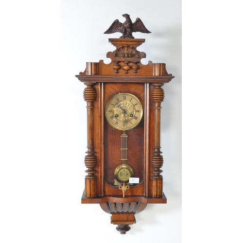 387 - 19th century Victorian mahogany wall clock with a glazed case and carved eagle mount atop. The case ... 