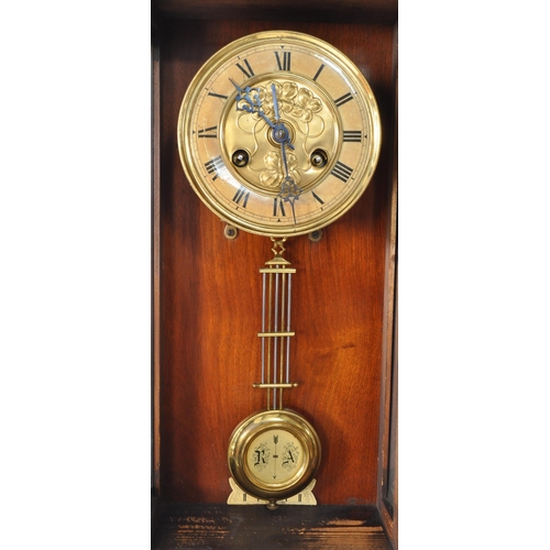 387 - 19th century Victorian mahogany wall clock with a glazed case and carved eagle mount atop. The case ... 