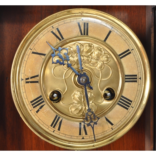 387 - 19th century Victorian mahogany wall clock with a glazed case and carved eagle mount atop. The case ... 