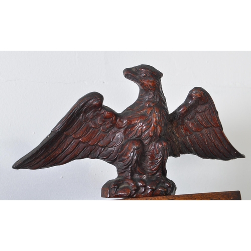 387 - 19th century Victorian mahogany wall clock with a glazed case and carved eagle mount atop. The case ... 