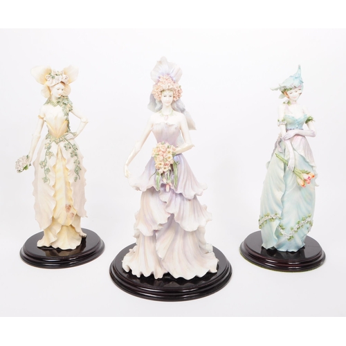 388 - The Leonardo Collection - A collection of three large resin Enchanted Garden flower fairy figurines.... 