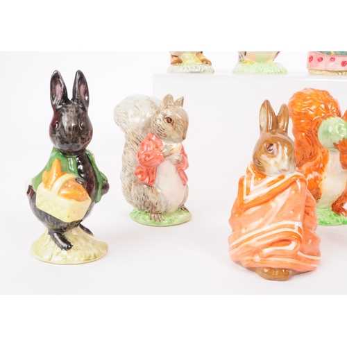 47 - Beswick - A collection of eleven 20th century porcelain Beatrix Potter figures, including, 'Squirrel... 