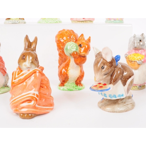 47 - Beswick - A collection of eleven 20th century porcelain Beatrix Potter figures, including, 'Squirrel... 