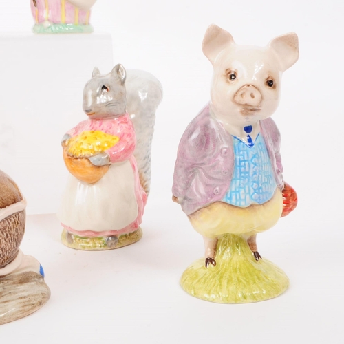 47 - Beswick - A collection of eleven 20th century porcelain Beatrix Potter figures, including, 'Squirrel... 