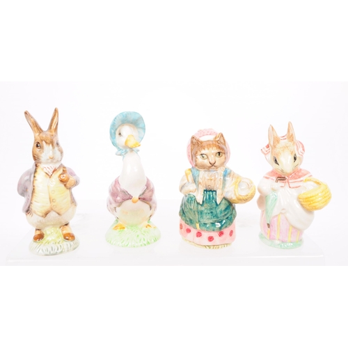 47 - Beswick - A collection of eleven 20th century porcelain Beatrix Potter figures, including, 'Squirrel... 