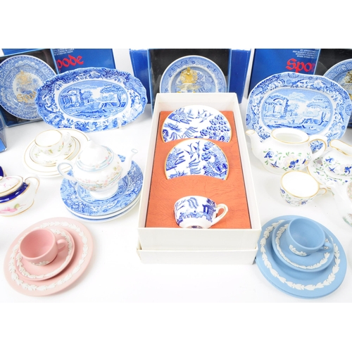 49 - A collection of late 20th century miniature china tea service pieces, including examples by Spode (b... 