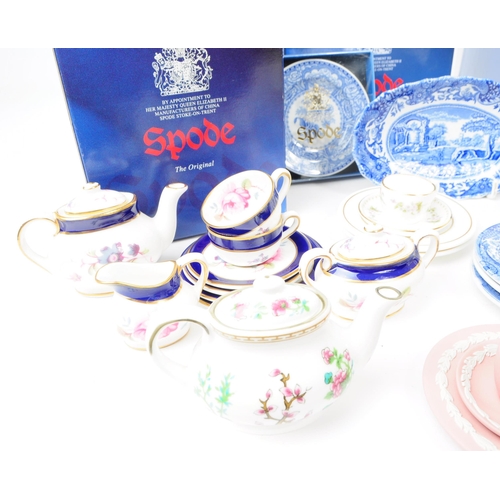 49 - A collection of late 20th century miniature china tea service pieces, including examples by Spode (b... 