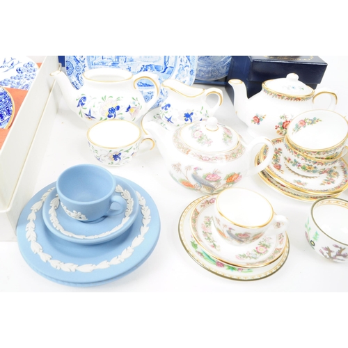 49 - A collection of late 20th century miniature china tea service pieces, including examples by Spode (b... 