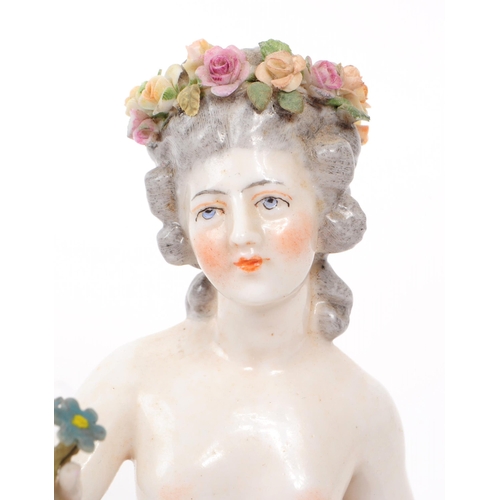 51 - Dressel & Kister - A 1910 Dresden German porcelain half doll figure, depicted holding flowers, m... 