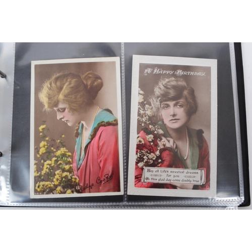 543 - A collection of Edwardian and early 20th century photographic portrait postcards. The collection fea... 