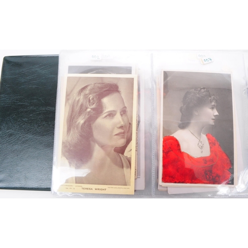 544 - A collection of Edwardian and early 20th century photographic portrait postcards. The collection fea... 