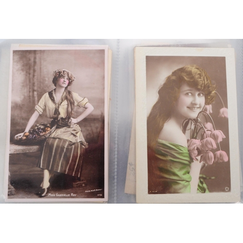 545 - A collection of Edwardian and early 20th century photgraphic portrait postcards. The collection feat... 