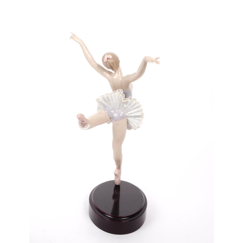 56 - Lladro - A vintage late 20th century ballerina porcelain figurine, the figure in a ballet pose, with... 