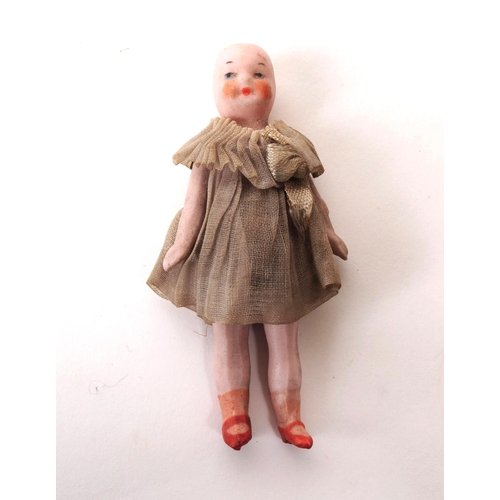 57 - Late 19th / early 20th century collection of four bisque small / miniature doll figures, comprised o... 