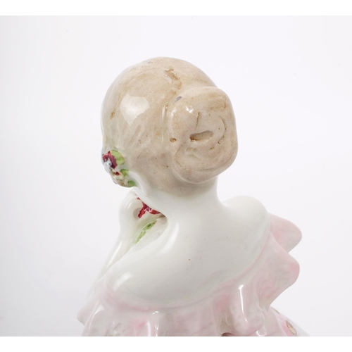 60 - Johann Petrides for Goldscheider - A 1920 art deco porcelain figurine of a girl holding a rose, feat... 