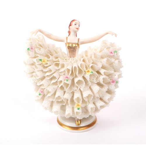 62 - Irish Dresden - A late 20th century porcelain dancer figurine, featuring a lace dress, hand painted ... 