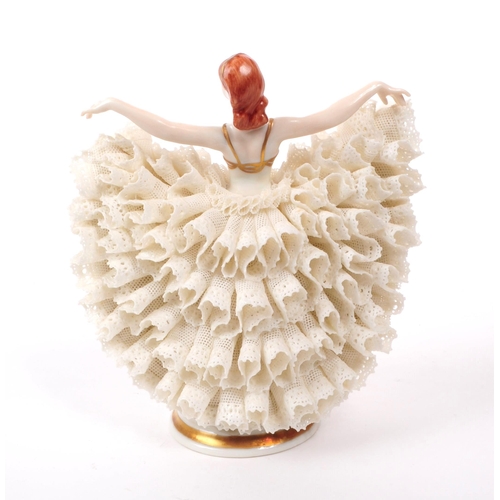 62 - Irish Dresden - A late 20th century porcelain dancer figurine, featuring a lace dress, hand painted ... 