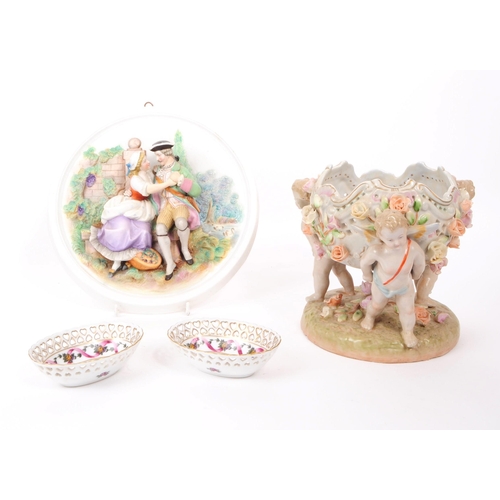 65 - A collection of 20th century German porcelain dishes and bowl, comprised of two small trinket dishes... 