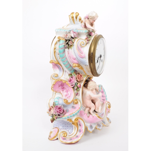 73 - Blaquart of Boulogne - Late 19th century German porcelain mantel clock. Features cherub figurines an... 